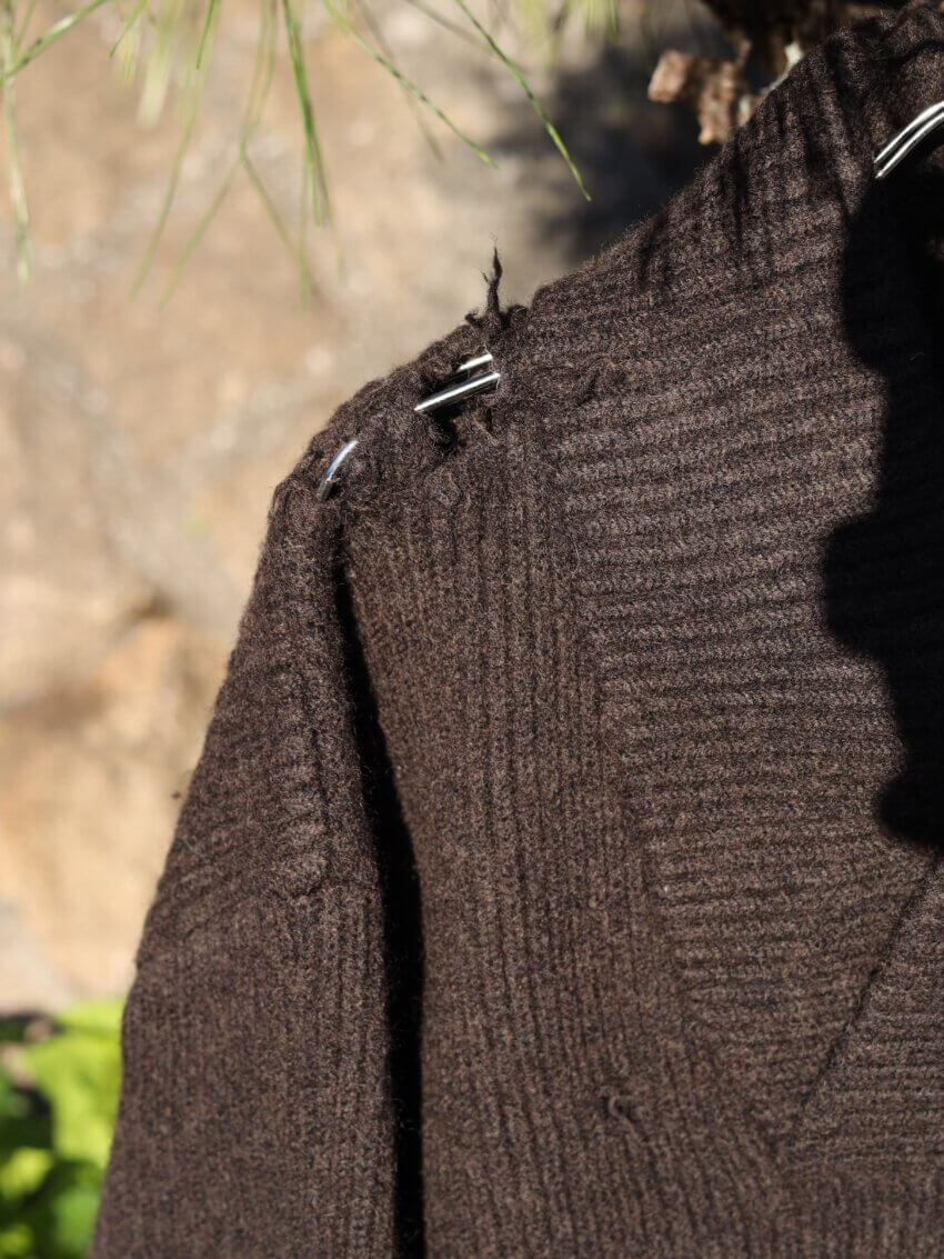 ヘドメイナーのショールカラーニットの生地